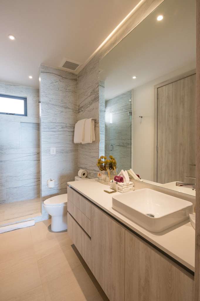 Modern master bathroom with dual vanity and luxury finishes
