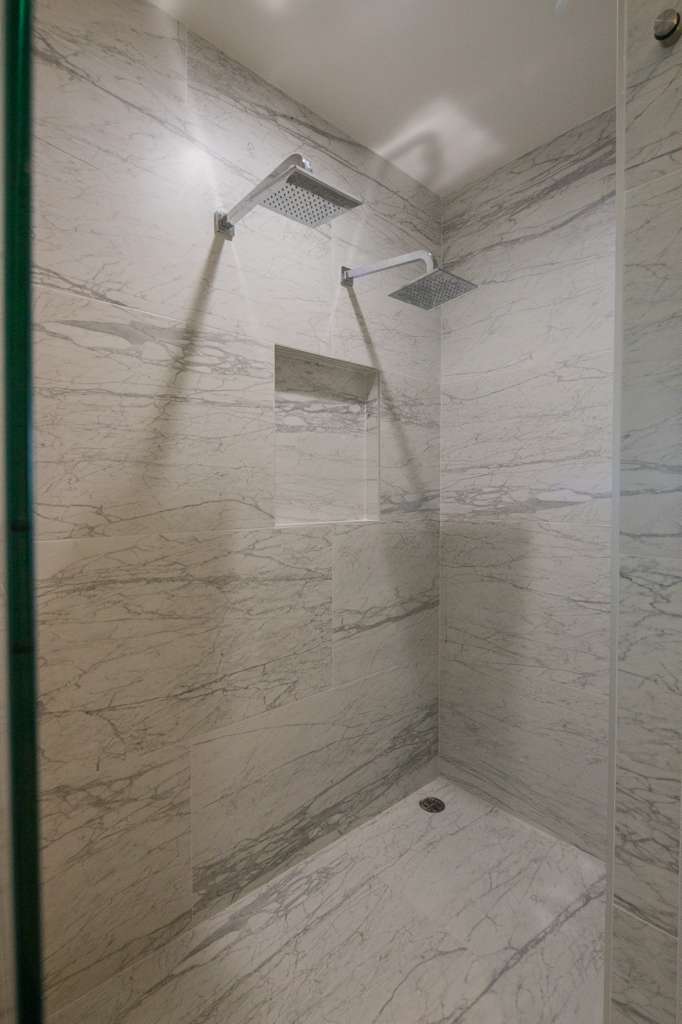 Spacious walk-in shower with premium tiling